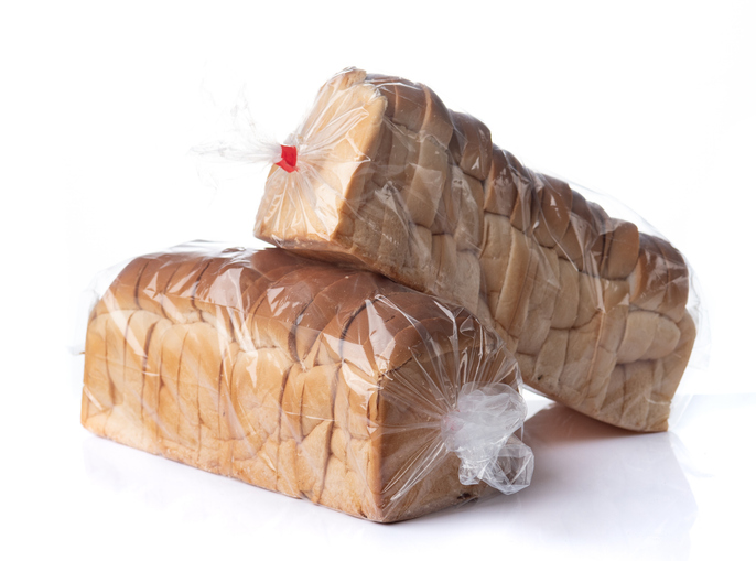 Sliced toast bread in plastic bag on a white background