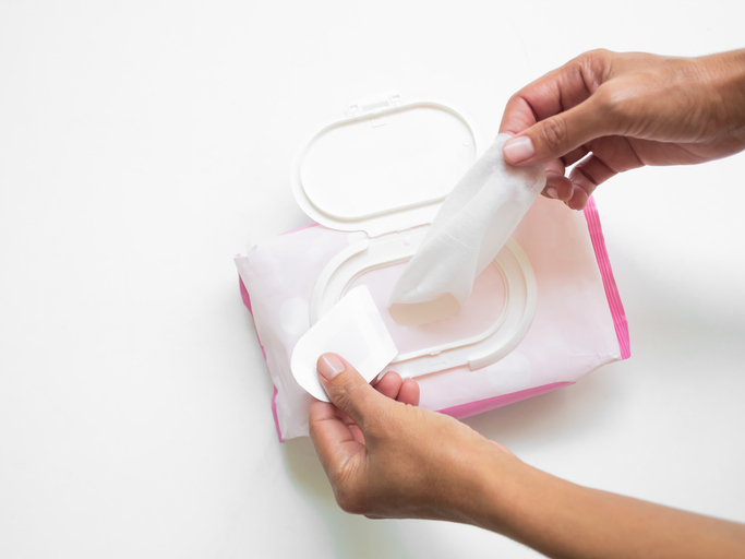 Wet Wipes Hand woman holding Tissue Paper Mokcup Wipe for Cean Hygiene Hand and wipe Cosmetic Beauty on Face, Baby, Packet in Toilet.